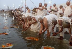 Newly initiated Sadhvis, or Hindu ascetic women, of the Juna Akhara attend the Dikasha ritual on the banks of the river Ganges during the ongoing ‘Kumbh Mela’, in Prayagraj.