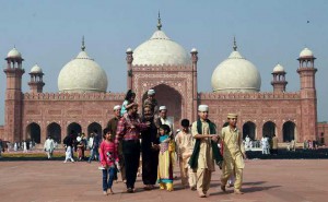 Pakistani Muslim come out after offering Eid al-Adha pray at the Badshahi Mosque in Lahore on September 25, 2015
