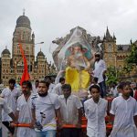 People carry god Ganesha’s idol to the pandal for the upcoming Ganesha festival in Mumbai