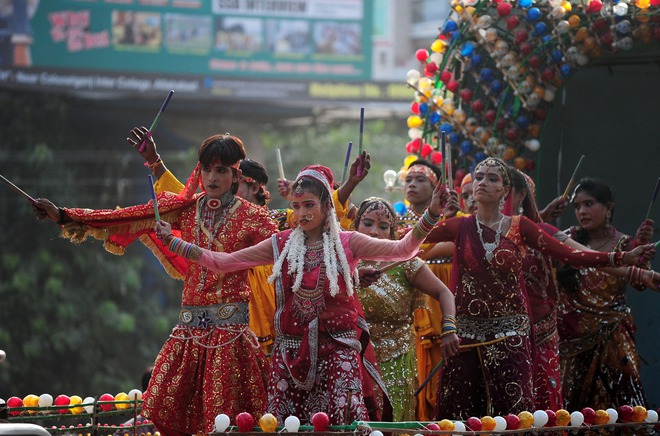 Performers dance during a religious procession on the eve of Janmashtami, a festival that marks the birth anniversary of Hindu Lord Krishna, in Allahabad on September 4, 2015.