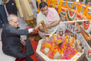 President Pranab Mukherjee offers prayers at a temple on mark Janmashtami, a festival that marks the birth anniversary of Hindu Lord Krishna, at President Estate in New Delhi on September 5, 2015