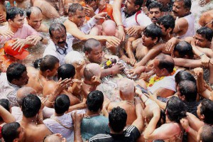 Sadhus or Hindu holy men arrive to take a holy dip in the waters of Godavari river during the second ‘Shahi Snan’ (grand bath) at the Kumbh Mela or Pitcher Festival in Nashik on September 13, 2015