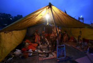 Sadhus, or Hindu holy men, sit inside their tent during the second ‘Shahi Snan’ (grand bath) at Kumbh Mela, or Pitcher Festival, in Trimbakeshwar, on September 13, 2015