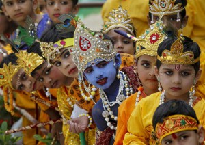 Schoolchildren dressed as Hindu Lord Krishna wait to perform during celebrations to mark Janmashtami, a festival that marks the birth anniversary of the Hindu God, in Chandigarh on September 5, 2015