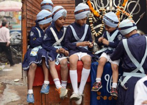 Sikh children participate in a Nagar Kirtan, a religious procession, in New Delhi on November 24, 2015, on the eve of the birth anniversary of Guru Nanak Dev.