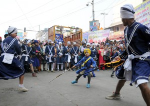Sikh devotees display their Gatka skills — a form of Sikh martial art — during a religious procession, a Nagar Kirtan, from Gurdwara Sis Ganj Sahib on the eve of the birth anniversary of Guru Nanak Dev.