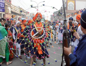 Sikh devotees display their Gatka skills — a form of Sikh martial art — during a religious procession, a Nagar Kirtan, from Gurdwara Sis Ganj Sahib on the eve of the birth anniversary of Guru Nanak Dev.