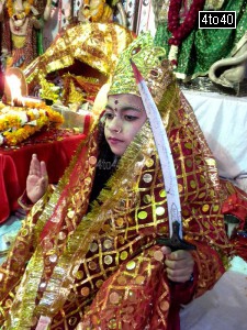 A girl child dressed as Maa Sherawali at Mata Ki Chawki