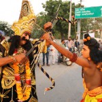 A man dressed as Hindu God Ram and demon king Ravana engage in a mock fight during Dusshera celebrations in Bathinda on October 22, 2015. The celebrations mark the end of the nine-day Navratri festival