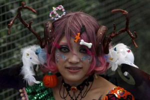 A participant in costume poses for a picture after a Halloween parade in Kawasaki, south of Tokyo, on October 25, 2015
