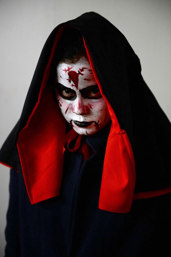 A student dressed for a Halloween fashion show poses for a photograph in Bangalore on October 31, 2015