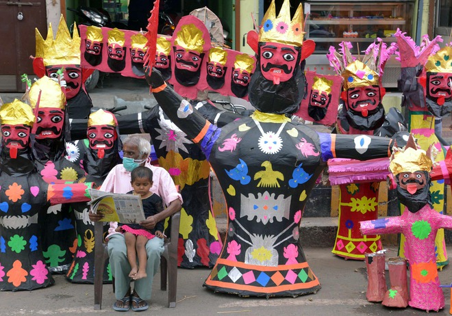 A vendor sells effigies of the Hindu demon King Ravana on the roadside in Amritsar on October 20, 2015, ahead of the Hindu festival of Dussehra