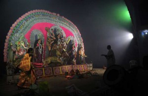 An Hindu priest performs rituals during the Durga Puja festival in Allahabad on October 20, 2015