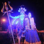 An Indian artist dressed as Hindu god Shiva performs on a chariot as he participates in a religious procession ‘Ravan ki Barat’ held to mark the forthcoming Dussehra festival in Allahabad on September 26, 2016.