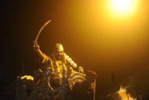 An Indian artiste dressed as demon king Ravana laughs as he sits on a elephant during a religious procession ‘Ravan ki Barat’ in Allahabad on September 26, 2016, held to mark the Dussehra festival.