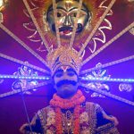An Indian artiste dressed as son of Hindu demon king Ravana, Meghnath, sits on a chariot, as he takes part in a ‘Ravan ki Barat’ religious procession held to mark the forthcoming Dussehra festival in Allahabad on September 26, 2016.