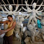 An artisan works on an idol of Hindu Goddess Durga at a workshop ahead of the Durga Puja festival in Kolkata, on September 20, 2016.