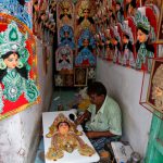 An artisan works on an idol of Hindu goddess Durga at a workshop ahead of the Durga Puja festival in Kolkata, India, September 20, 2016.