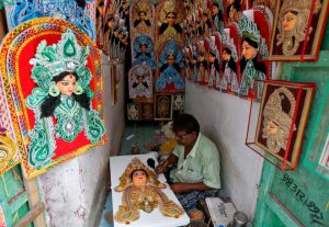 An artisan works on an idol of Hindu goddess Durga at a workshop ahead of the Durga Puja festival in Kolkata, India, September 20, 2016.