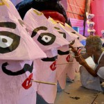 An artist paints the face of Hindu demon King Ravana in Surat on October 20, 2015, ahead of the Hindu festival of Dussehra