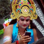 An artiste clicks a selfie during shoba yatra on the eve of Navratri festival in Katra