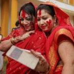 Bangladeshi Hindu devotees, with sindoor, or vermillion on their faces