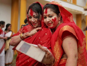 Bangladeshi Hindu devotees, with sindoor, or vermillion on their faces