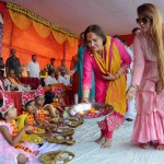 Bollywood actress Jaya Prada (left) offers Kumari Puja on the first day of the nine-day Navratri festival at Mirzapur in Uttar Pradesh