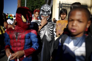 Children participate in the School on Wheels Skid Row Halloween Parade for children who live in shelters, motels, cars and on the street, in Los Angeles on October 30, 2015