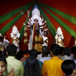 Devotees gather to worship an idol of the Hindu goddess Durga at a pandal or temporary platform during the Durga Puja festival in Kolkata on October 21, 2015