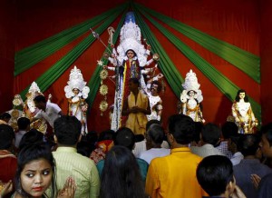 Devotees gather to worship an idol of the Hindu goddess Durga at a pandal or temporary platform during the Durga Puja festival in Kolkata on October 21, 2015