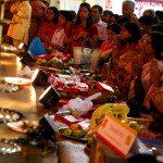 Devotees make offerings and pray at Goddess Durga idol