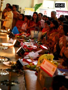 Devotees make offerings and pray at Goddess Durga idol