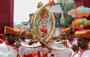 Devotees take a Durga idol to a pandal on the first day of the nine-day Navratri festival in Thane