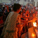 Devotees take blessings on completion of aarti at a Durga Puja pandal in Gurgaon