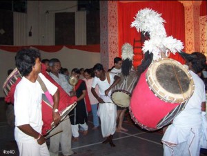 Dhakis playing dhak at a Durga Puja venue