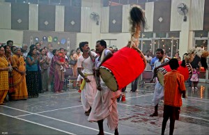 Dhakis playing dhak at a Durga Puja venue