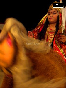 Girl dressed as Maa Sherawali