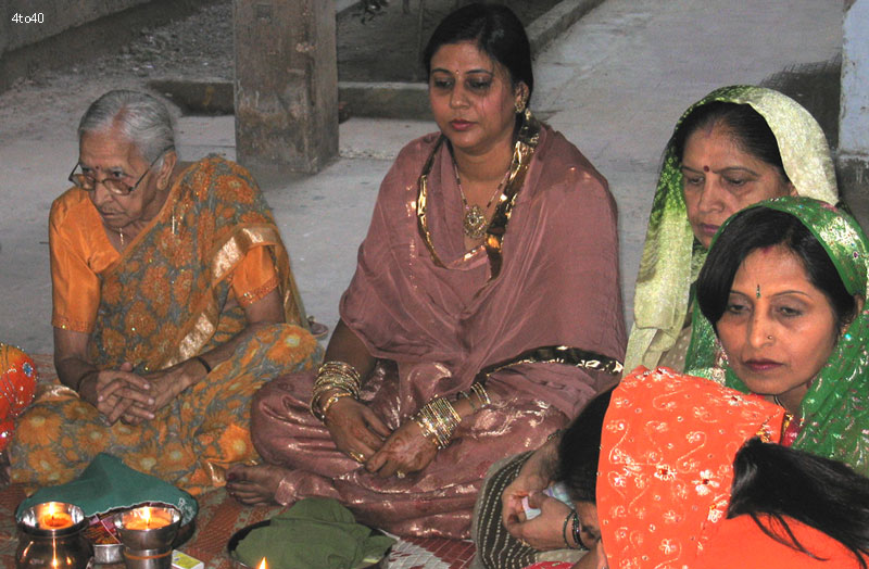 Hindu married women listening to Karwa chauth katha at Cosy Apartments Sector 9 Rohini New Delhi