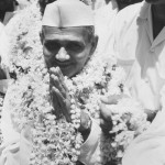 Home Minister of India Government Lal Bahadur Shastri wreathed in flowers as he arrives in Bharatpur