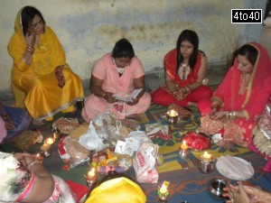 Married Hindu women perform day long fasting for the long life of their husband on the occasion of Karva Chauth