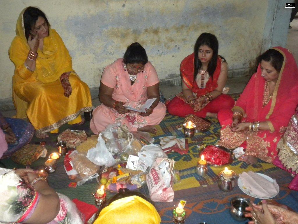 Married Hindu women perform day long fasting for the long life of their husband on the occasion of Karva Chauth