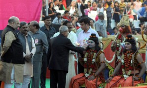 President Pranab Mukherjee offers his prayers to a man dressed as Hindu God Ram and Lakshman during Dussehra celebrations at the Red Fort Grounds in New Delhi on Thursday. BJP president Amit Shah also pictured