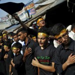 Shi'ite Muslim mourners beat their chests during a Muharram procession to mark Ashura in Delhi on October 24, 2015