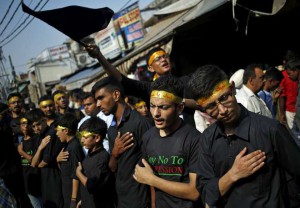 Shi'ite Muslim mourners beat their chests during a Muharram procession to mark Ashura in Delhi on October 24, 2015
