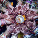 Women a perform ritual on Karva Chauth, traditional Hindu festival celebrated in northern India during which married women fast one whole day and offer prayers to the moon for the welfare, prosperity, and longevity of their husbands, in Ahmedabad on October 22, 2015
