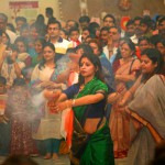 Women devotees performing Dhunuchi Naach at a Gurgaon Durga Puja Pavilion