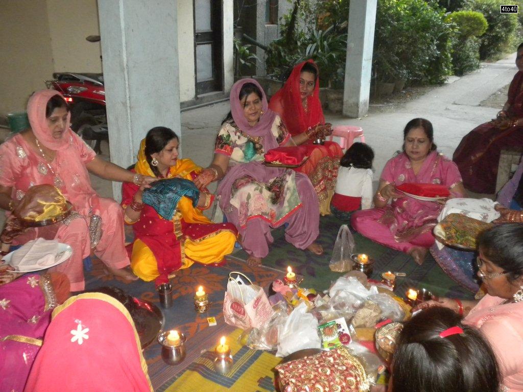 Women of Cosy Apartments, Sector 9, Rohini, New Delhi performing Karva Chauth Thali phera