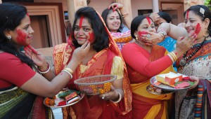 Women playing with vermillion powder (Sindoor Khela) on the last day of the Durga Puja festival in Chandigarh