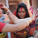 Women playing with vermillion powder (Sindoor Khela) on the last day of the Durga Puja festival in Chandigarh
